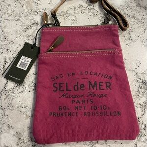 Brand new cross body Maya bag. More plumb in color than purple.
